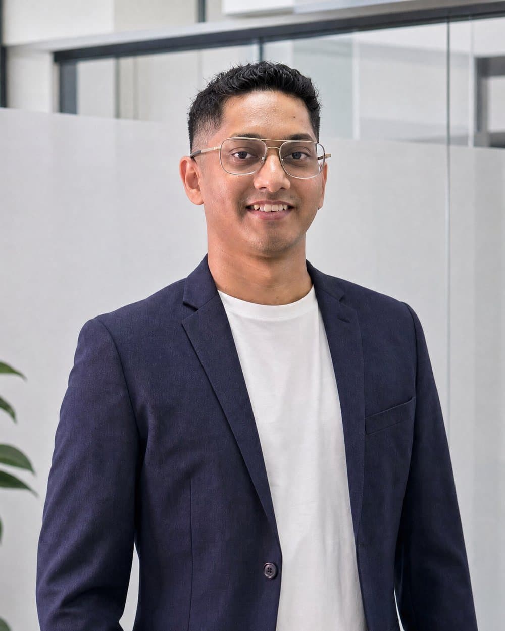 Ravi Kowlessur, AI and digital transformation consultant, in a navy blazer